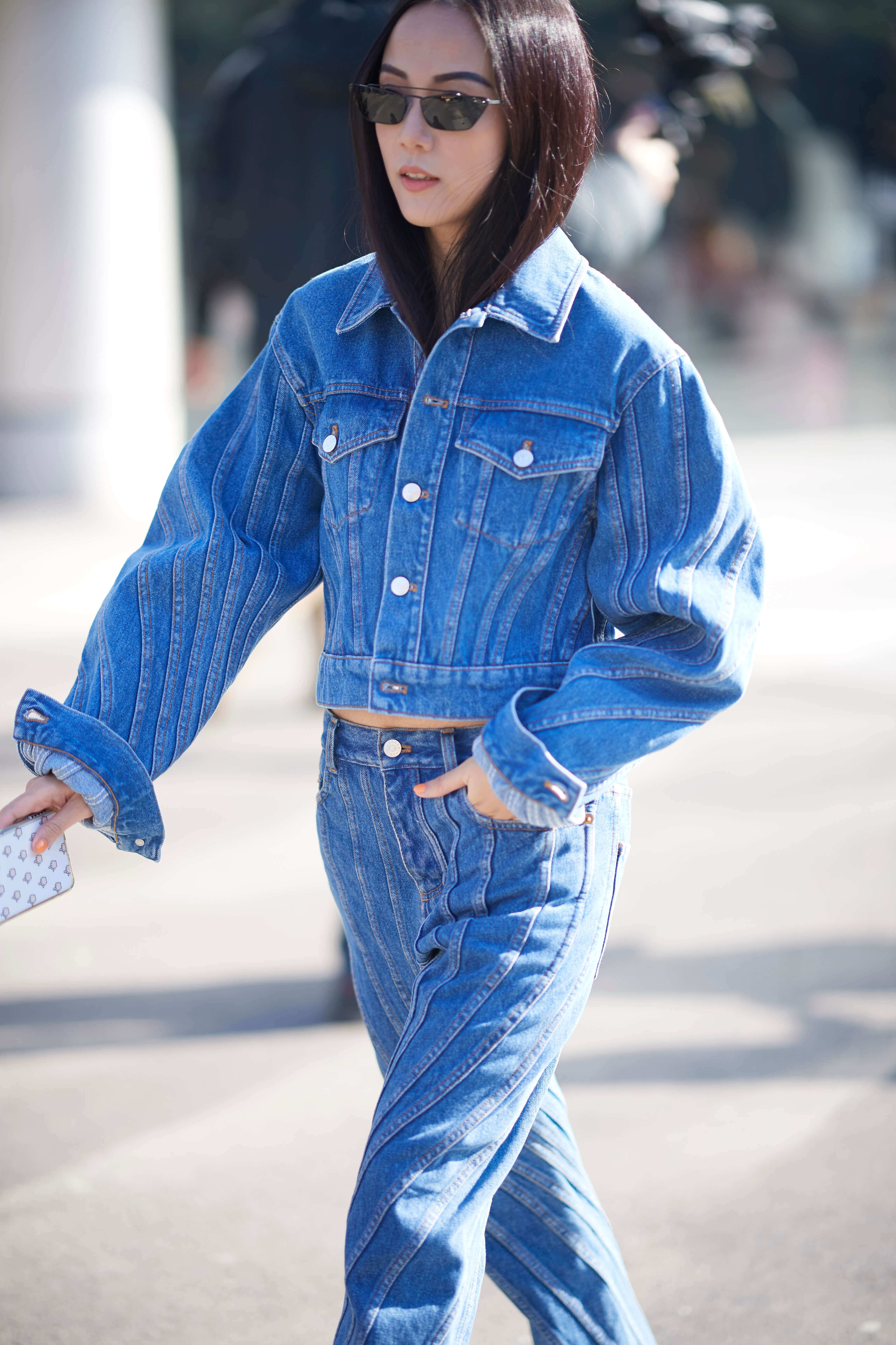 Model in high rise denim outfit