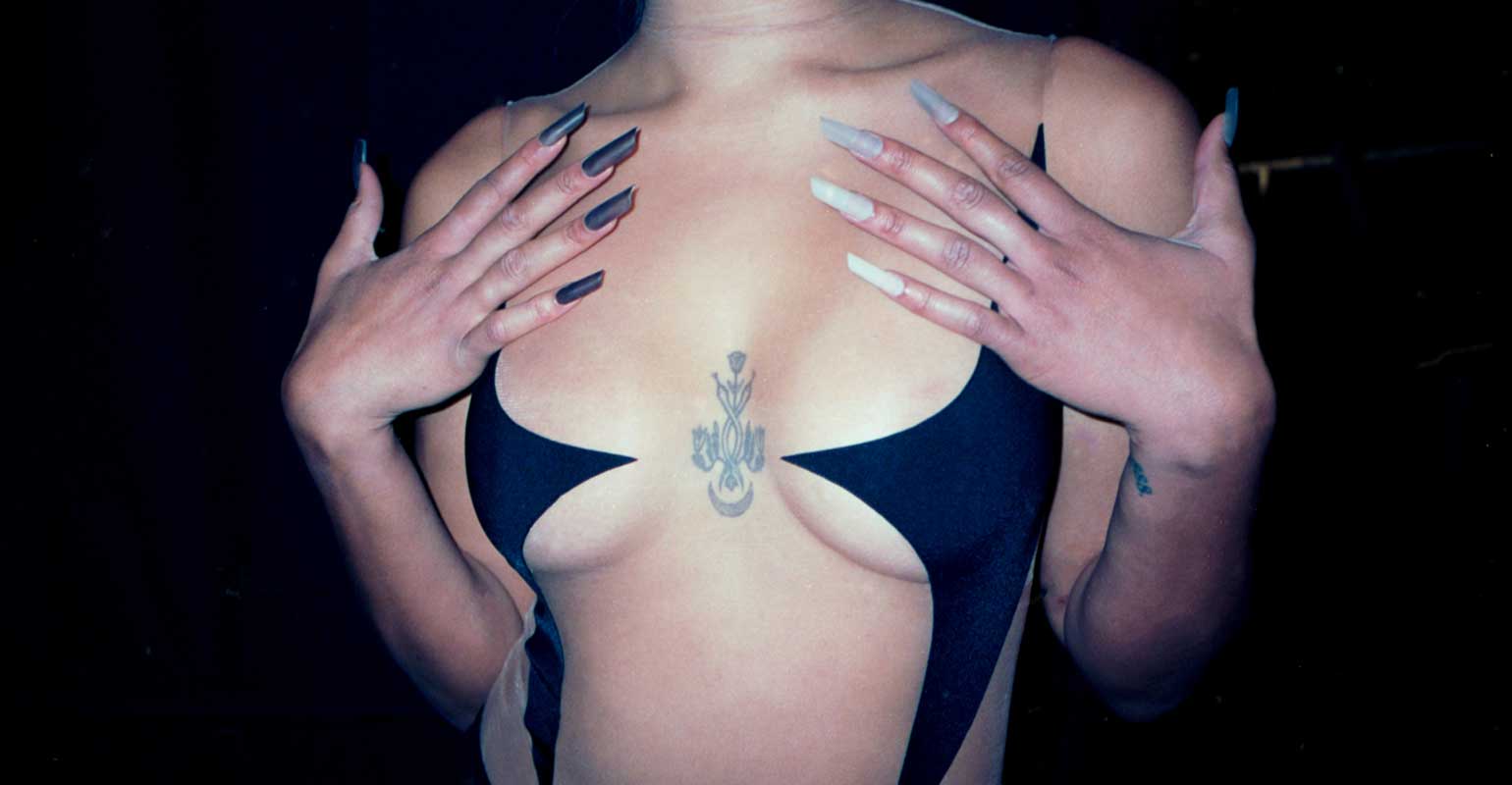 Model's chest with cutout Mugler bra